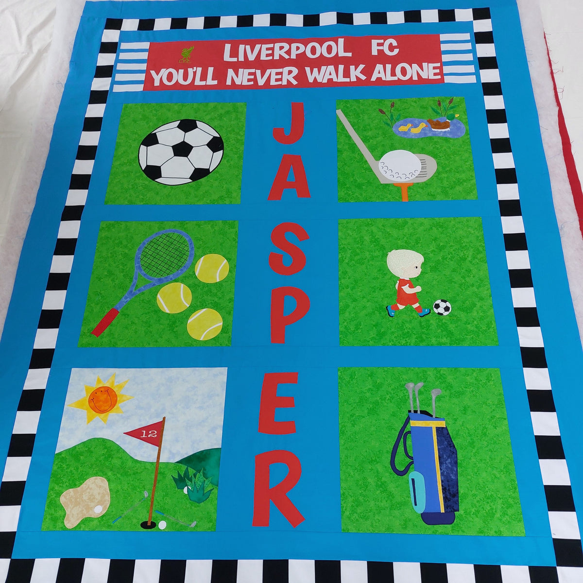 a picture of the whole sport quilt showing the different sports with Liverpool FC at the top