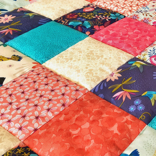 a close-up of the squares patches on the front of the quilt
