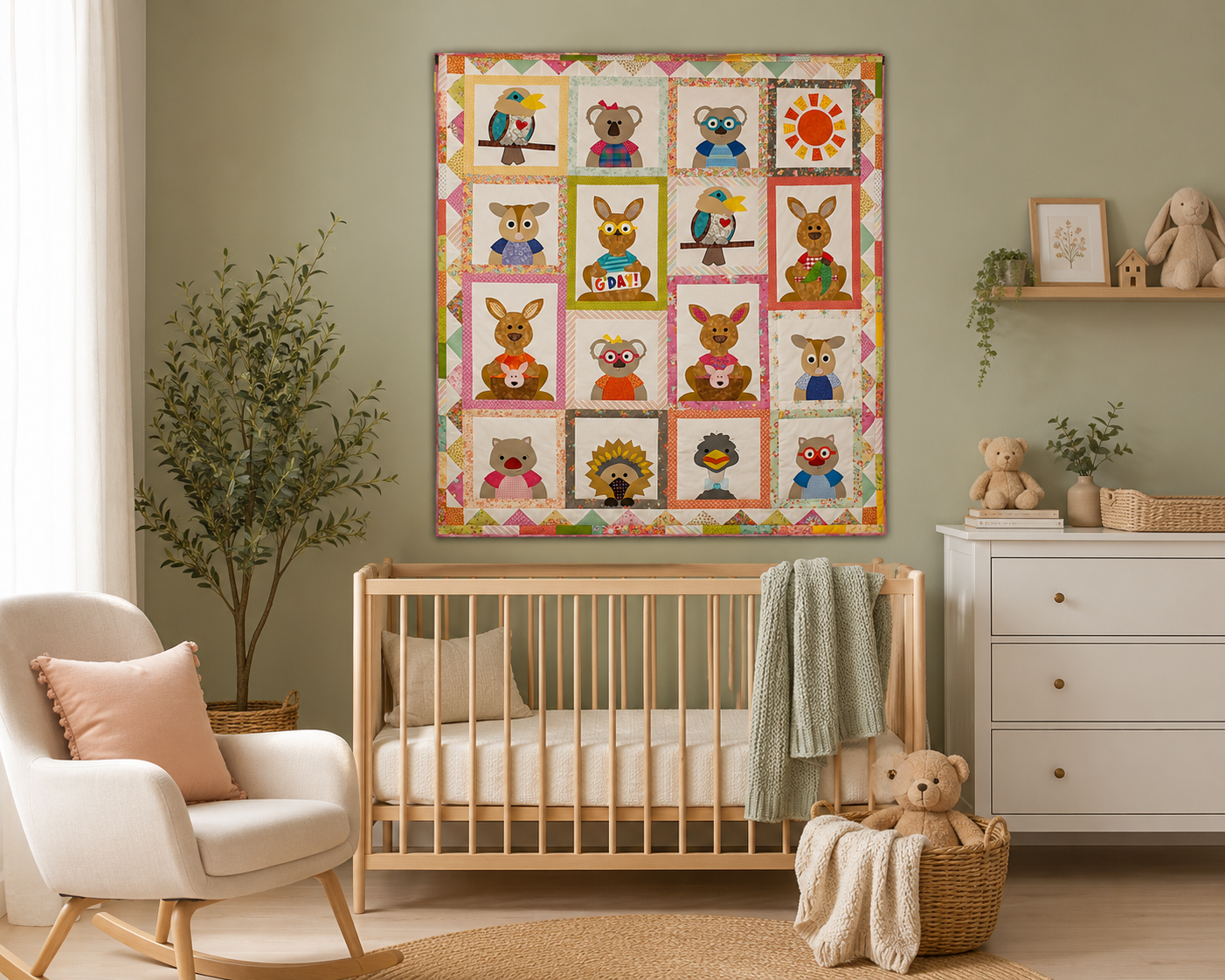 A colorful quilted wall hanging with cartoon animal patches is displayed in a styled nursery room above a wooden crib, with an armchair, dresser, and plants visible.