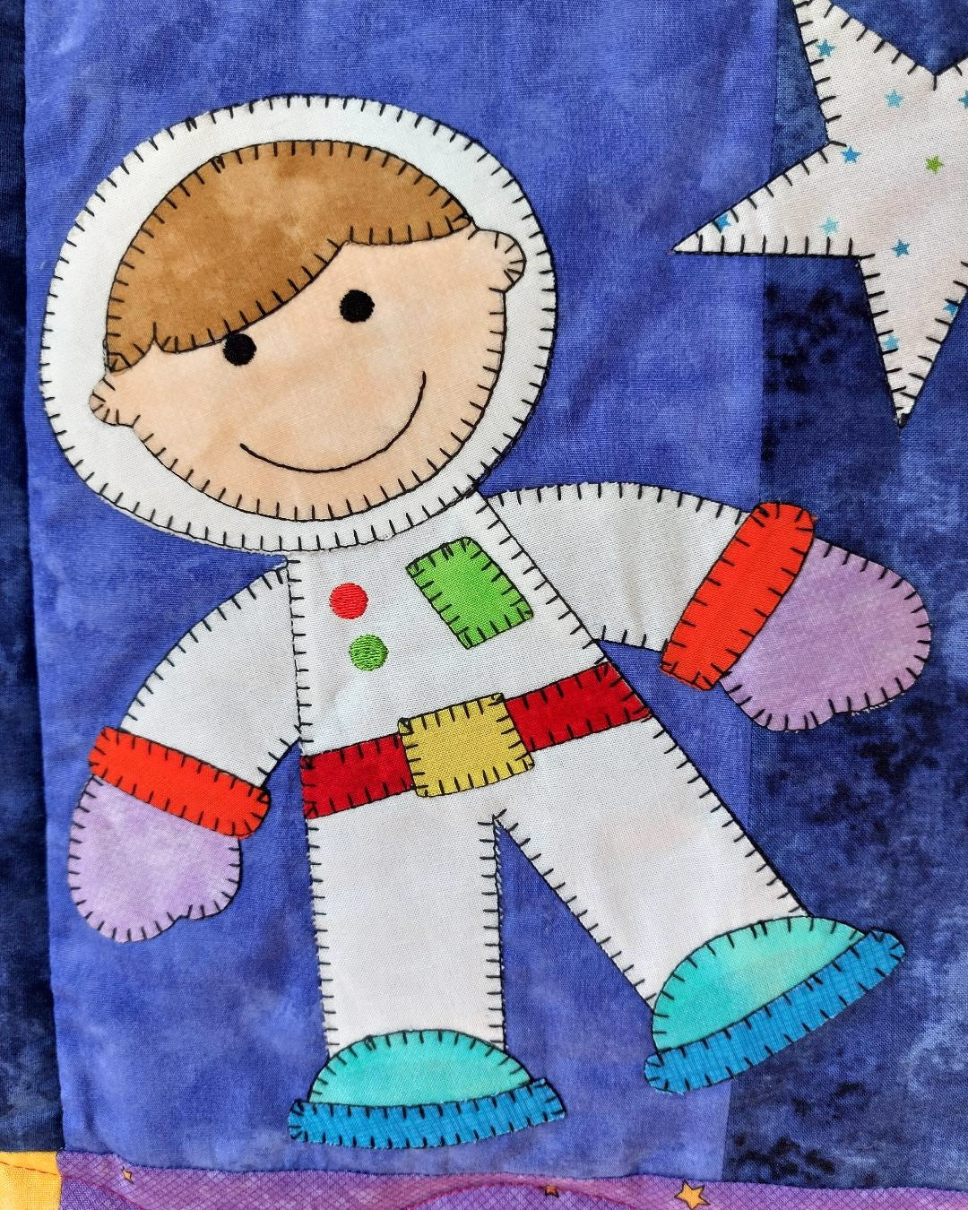 a boy astronaut in a space suit floating around in space