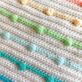 blue, green and yellow crochet rainbow bobbles 