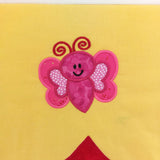 Pink butterfly with red antennae on a yellow background