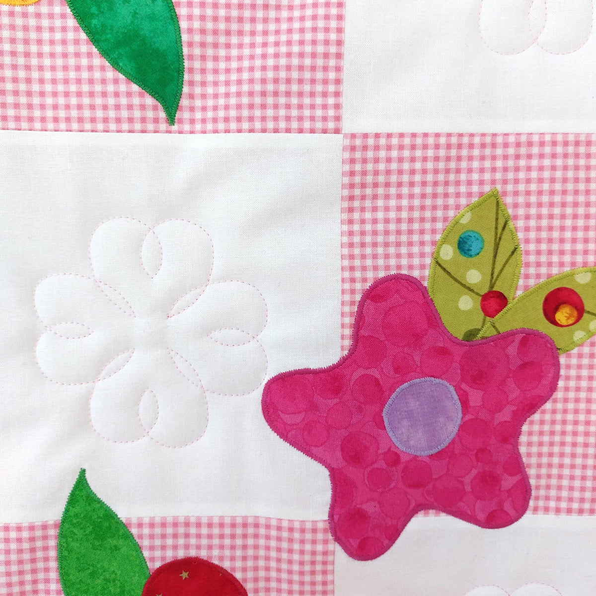 pink check and alternating white squares with a pink flower and bright leaves