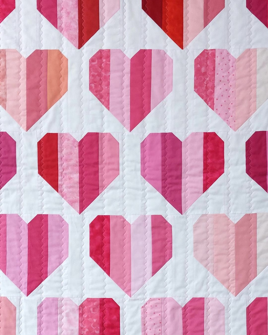 close up of red and pink striped hearts