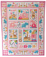 Children's quilt with colourful jungle animal patterns on a pink background