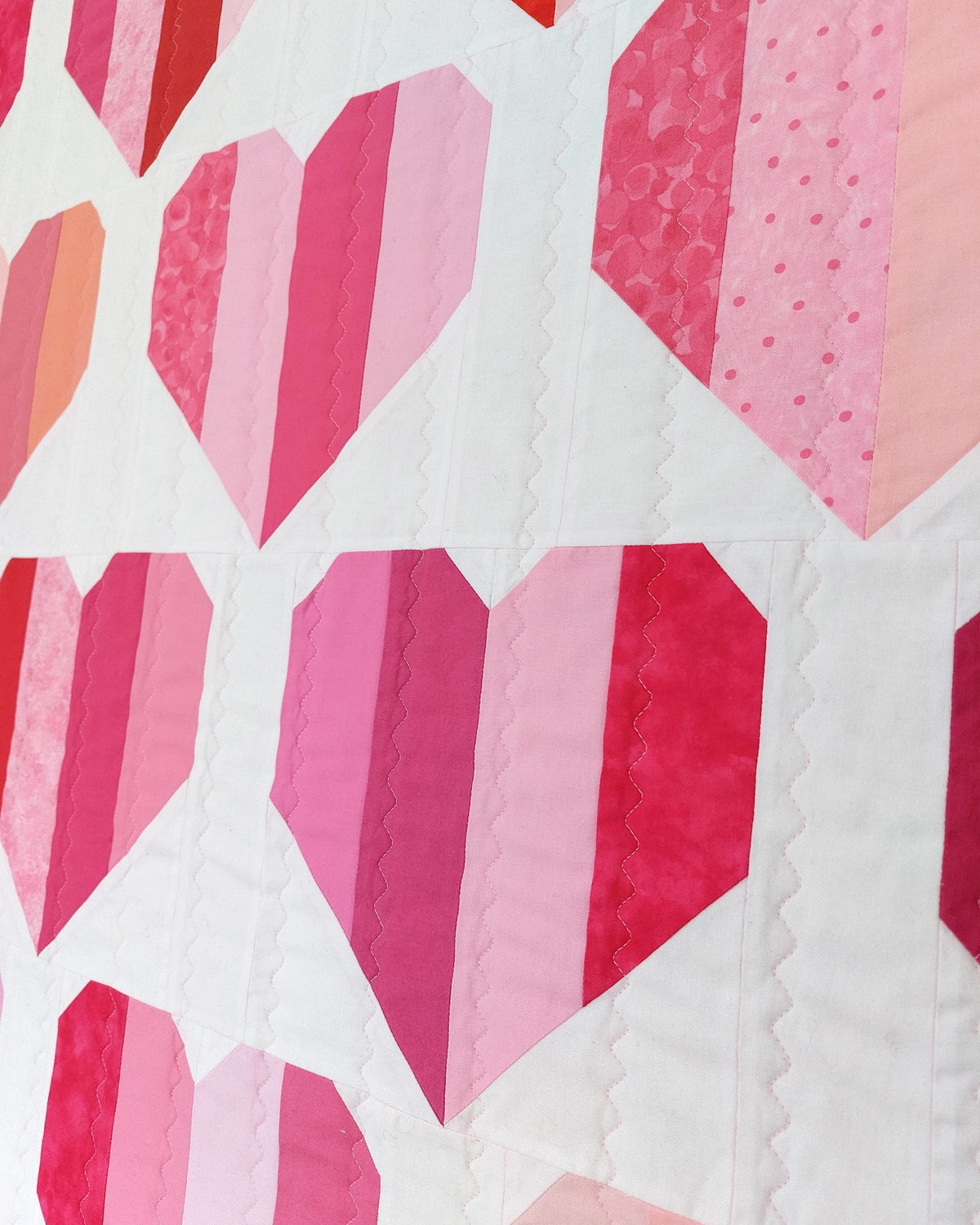 a side view of the pink and red hearts