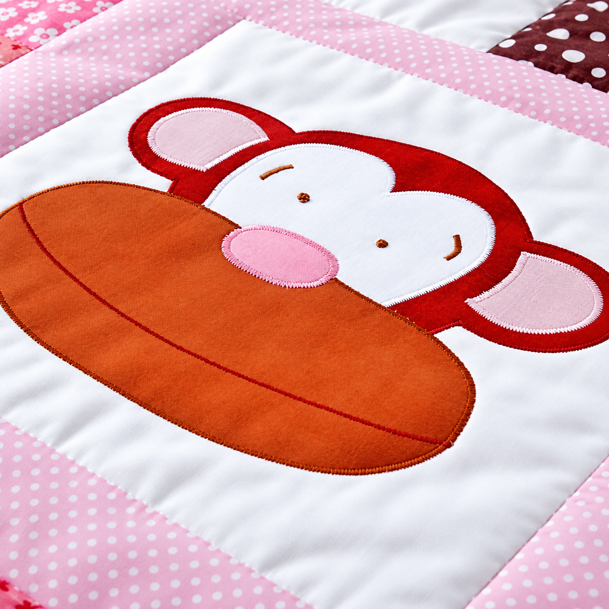 a brown smiling monkey face with pink ears and nose on a white background