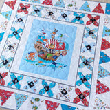 Children's quilt with pirate ship design on a white background