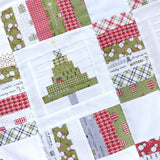 Collection of Christmas-themed fabric squares with trees and houses on a white background