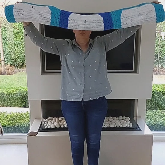 a video showing the un-furling of the panda blanket. There are nine squares with nine panda heads.