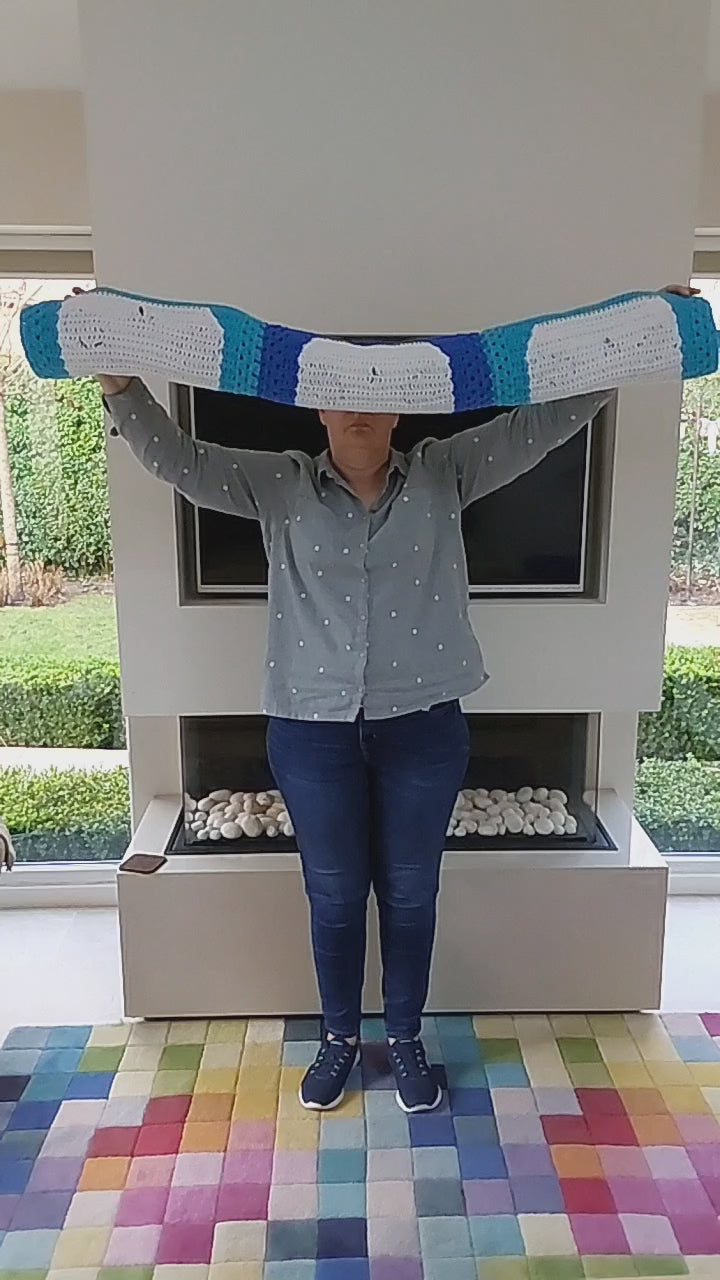 a video showing the un-furling of the panda blanket. There are nine squares with nine panda heads.