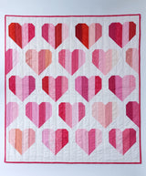 Rows of hearts made of of different coloured strips of red and pink fabric