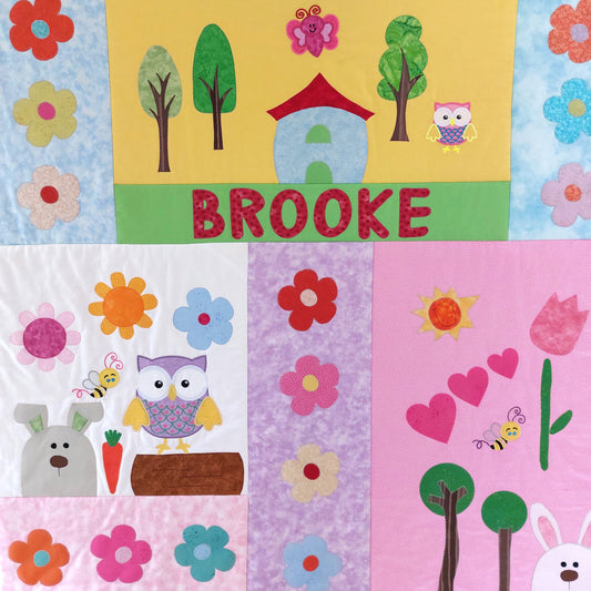 pink, purple, green and yellow fabric squares showing owls, bunnies, flowers and hearts