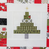 Patchwork quilt block with Christmas tree design on a white background