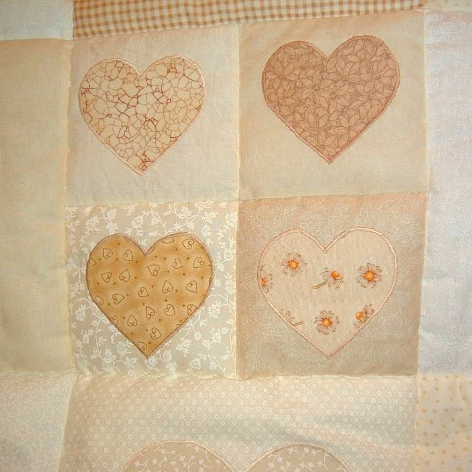 4 small hearts of different cream fabric