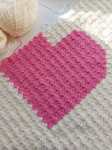 photo of the pink heart baby blanket in production and almost finished