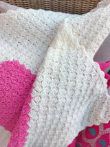close up of the texture of the handmade pink heart baby blanket