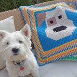 the cute puppy baby blanket laid out next a real life westie dog