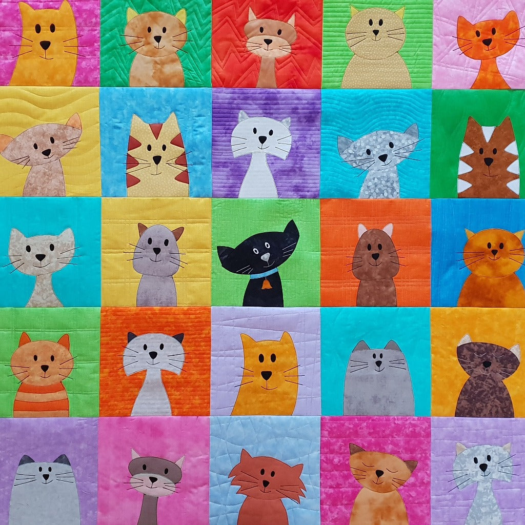 25 backgrounds of bright colours, including yellow, green, and red. On each background square in the face of a cute cat quilt