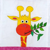 A yellow giraffe neck and head with orange spots and a big orange mouth eating a branch with leaves on it.