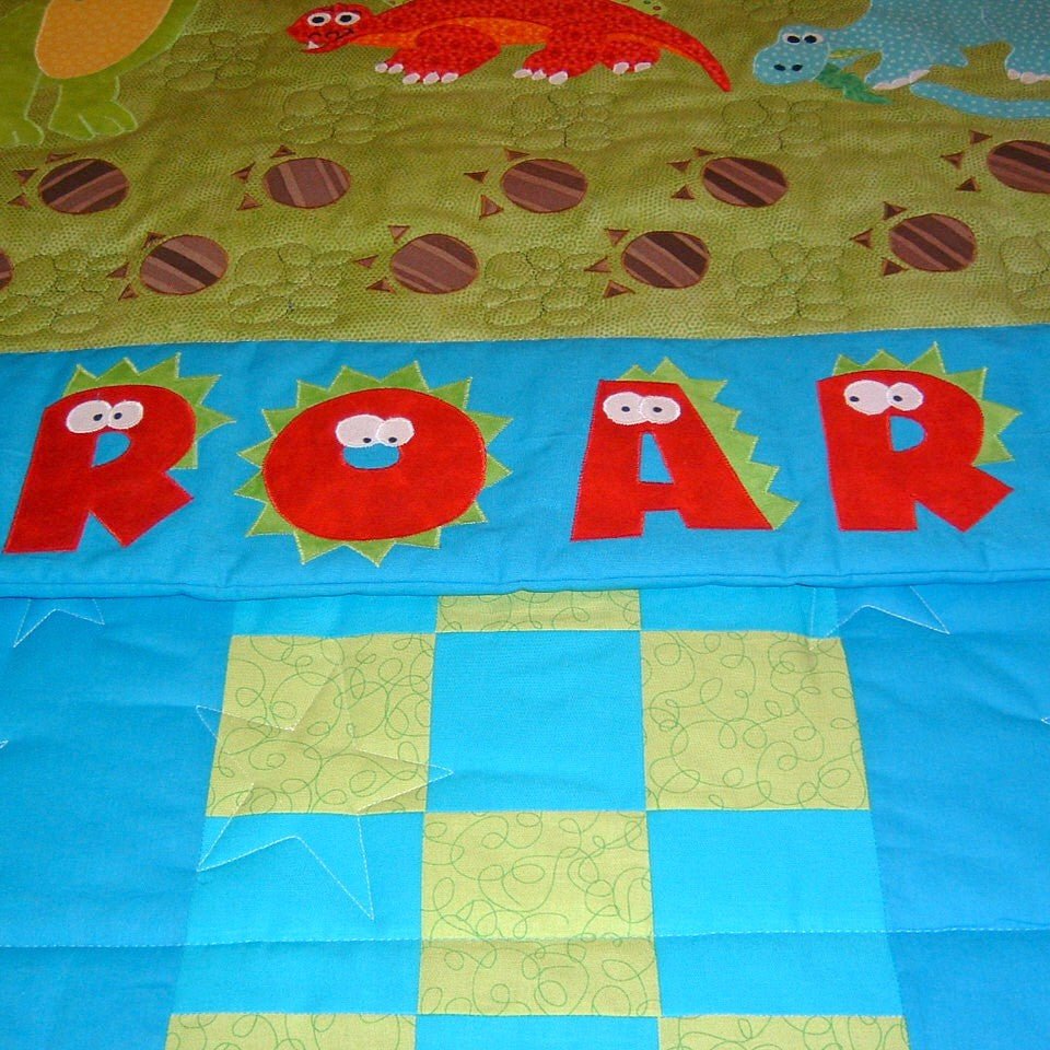  a colourful scene showing large dinosaurs and the imprints of their feet with the word roar in red