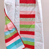 the back of the quilt on a quilt ladder