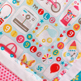 close up of the girl crazy fabric showing cars, butterflies a sweet machine and the words smile and giggle