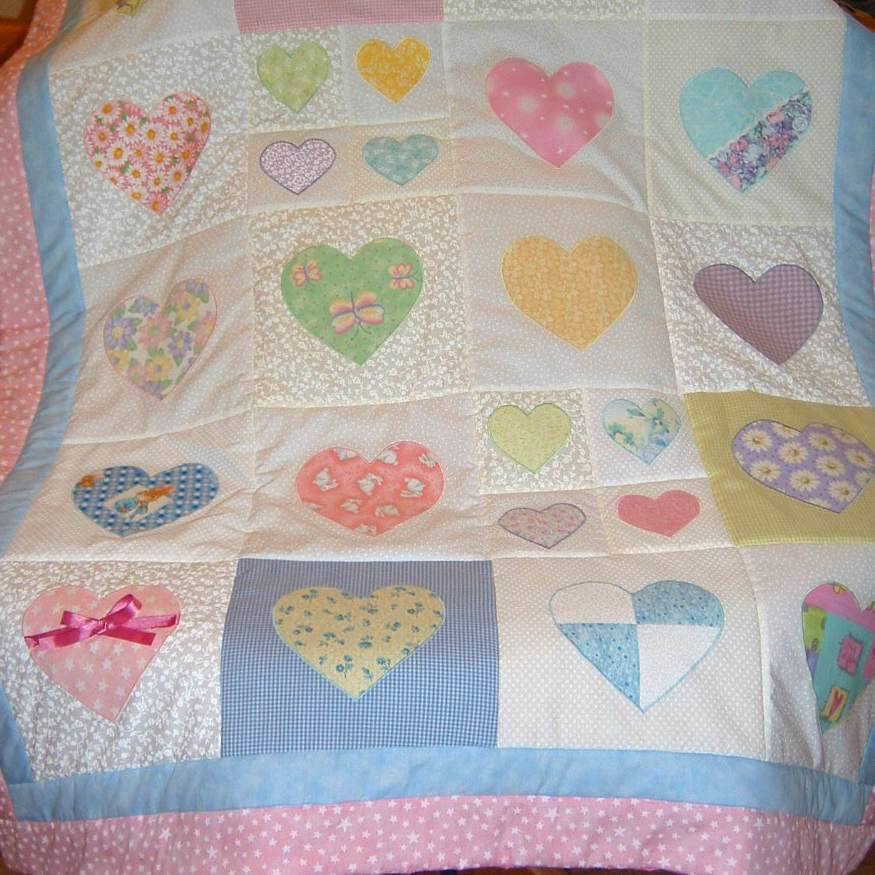 patchwork quilt with pastel coloured hearts