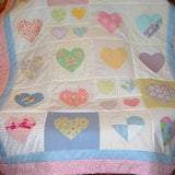 patchwork quilt with pastel coloured hearts