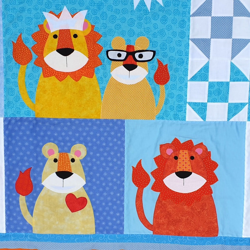 three different blue fabric backgrounds with a lion wearing a crown and his cub, another cub with a red heart on his chest  and a lioness