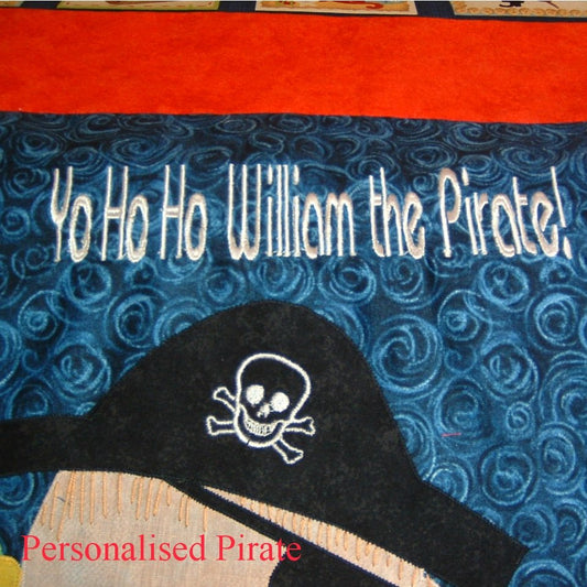 on a blue fabric background is machine embroidered in white, yo ho ho William the pirate!