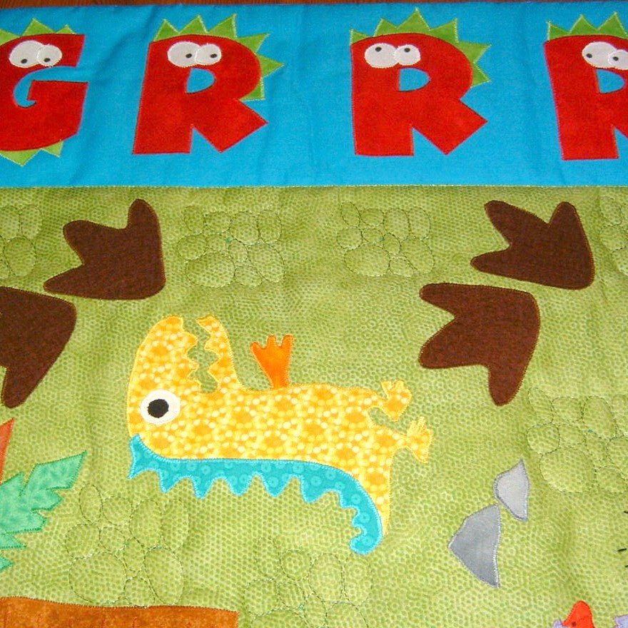 a green background with as yellow dinosaur and brown foot marks with the word roar in red