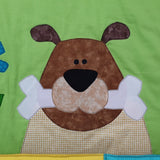 green background with a brown dog with a large white bone in its mouth